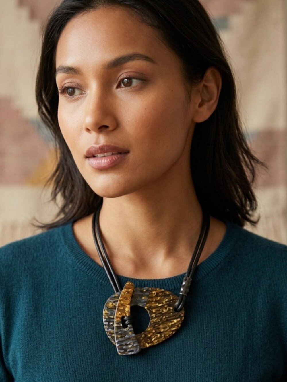 Necklace features a contemporary artisanal style
